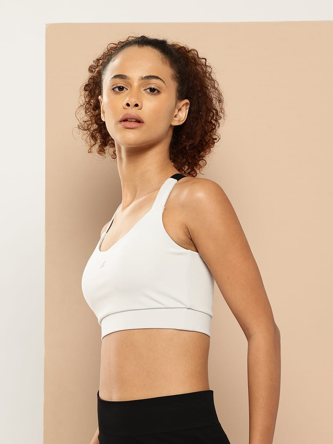 Alcis light grey training sports bra for women with slim fit, regular straps and all-day comfort.
