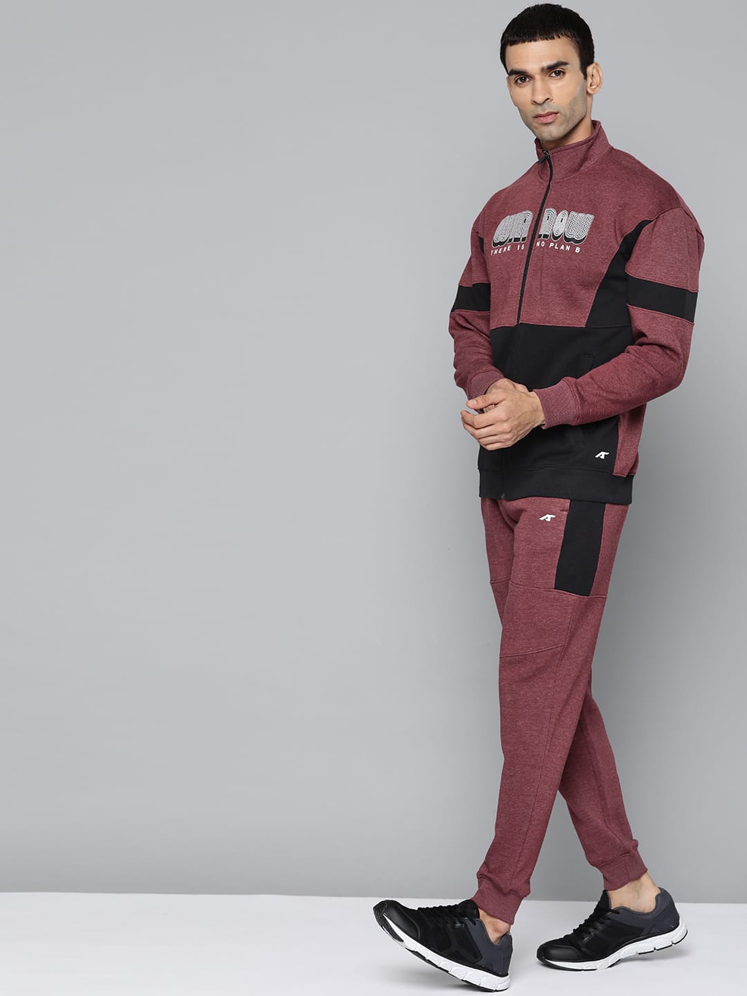 Alcis maroon sports tracksuit for men made from comfortable cotton blend fabric for active wear.