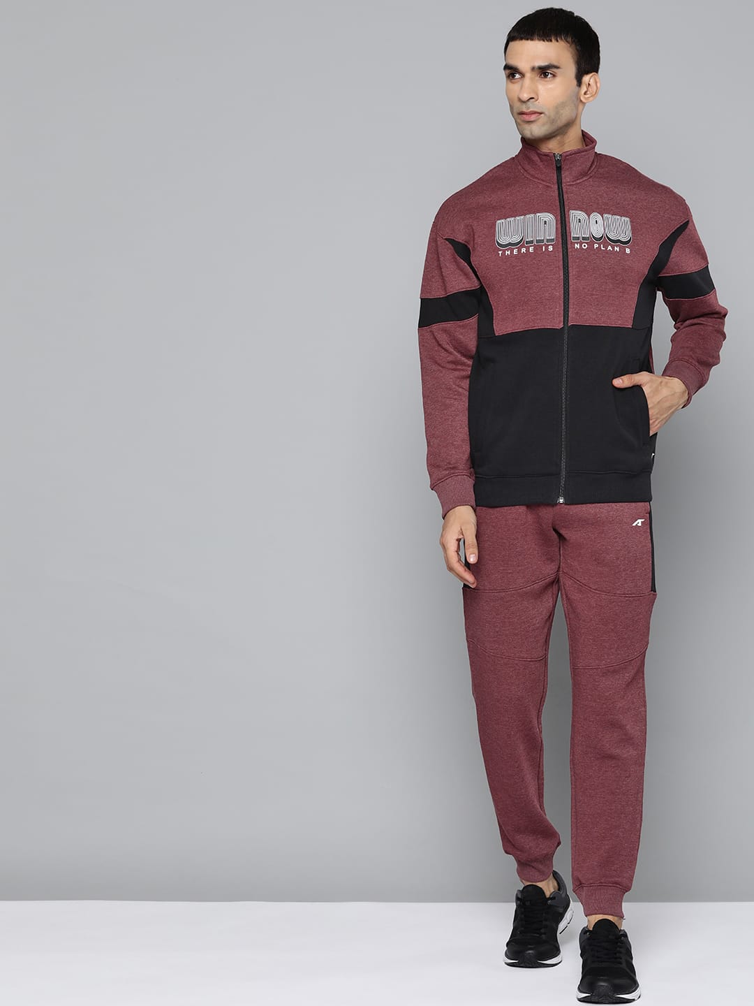 Alcis men maroon typography tracksuit with mock collar and regular fit for sports and training.