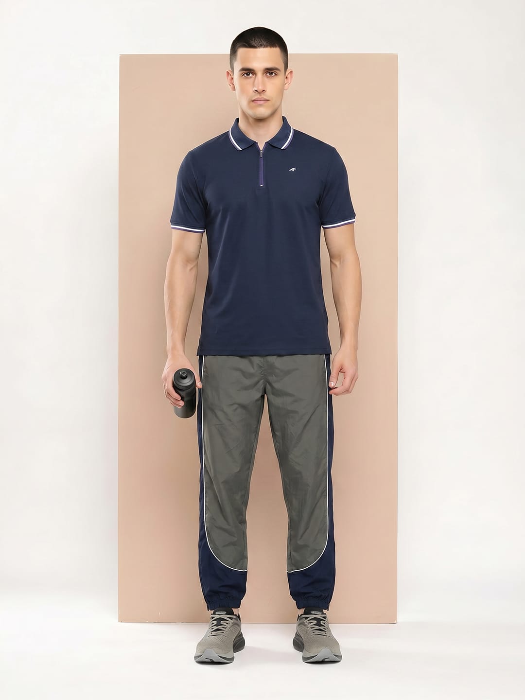 Alcis navy polo T-shirt for men with moisture-wicking polyester fabric for workouts and active wear.