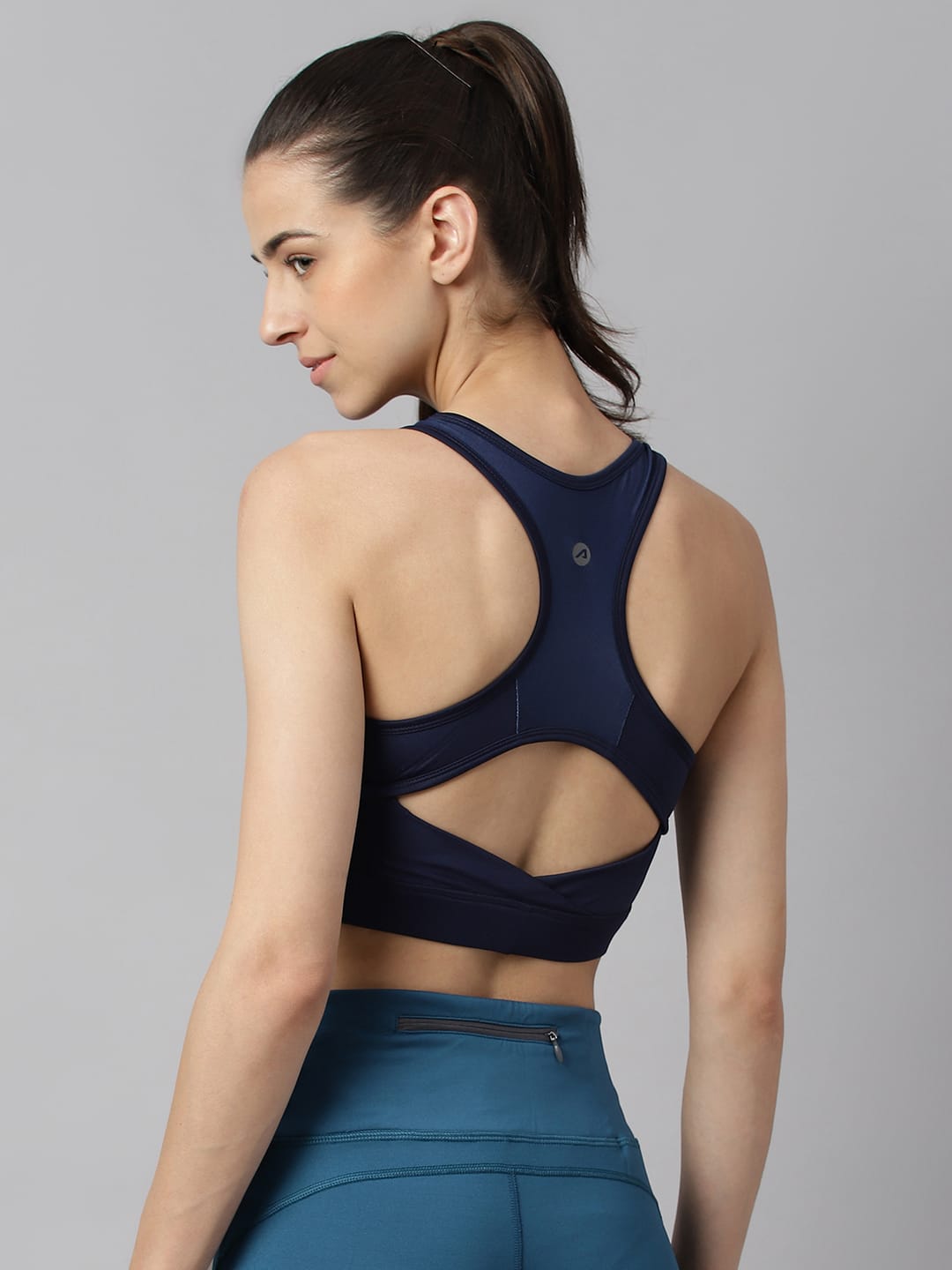 Alcis navy racerback high impact workout bra for women with flexible stretch fabric and comfortable support.