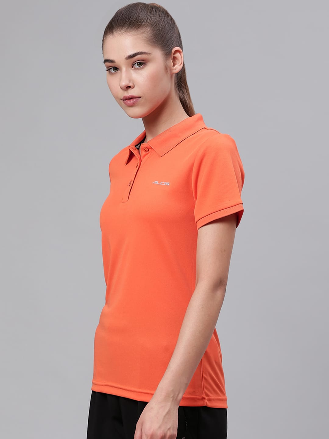 Alcis orange polo collar workout T-shirt for women with comfortable fit for gym, training and active wear.