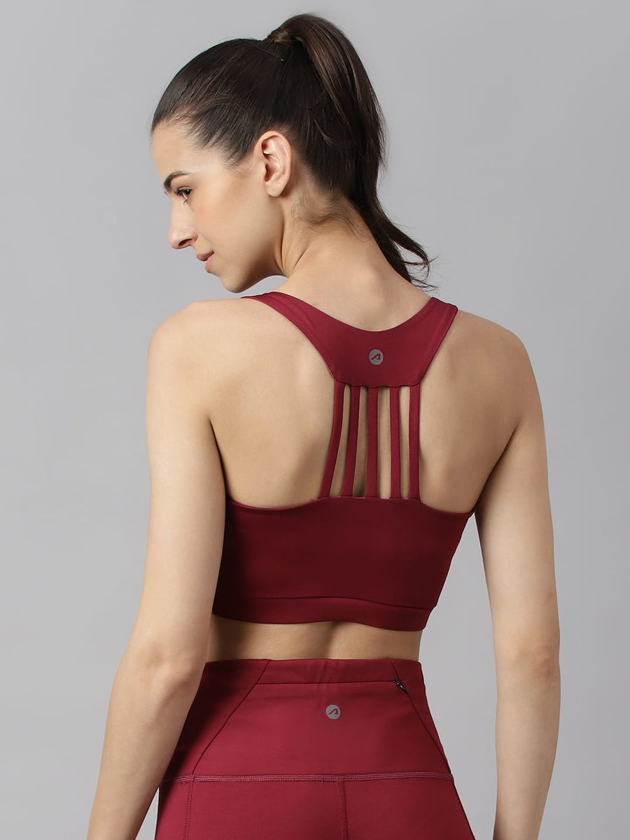 
                    
                      Alcis red plum racerback workout bra for women with breathable stretch fabric for yoga and fitness training.
                    
                  