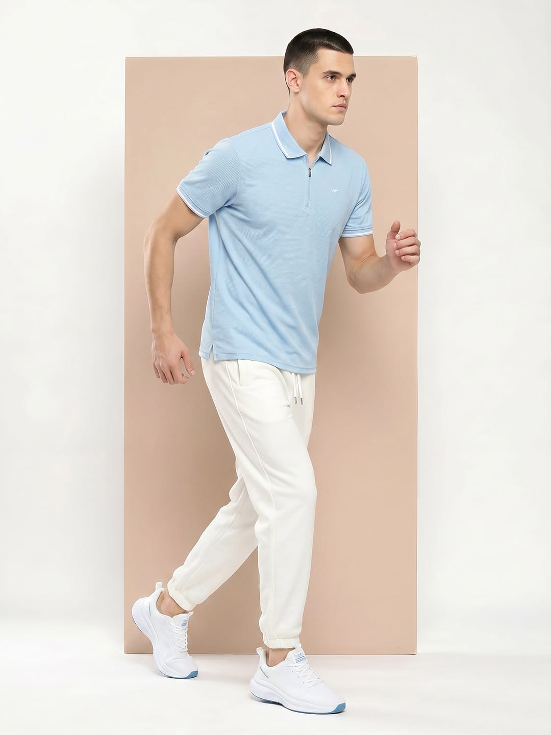 Alcis sky blue half-zip polo T-shirt for men with breathable performance fabric for training and workouts.