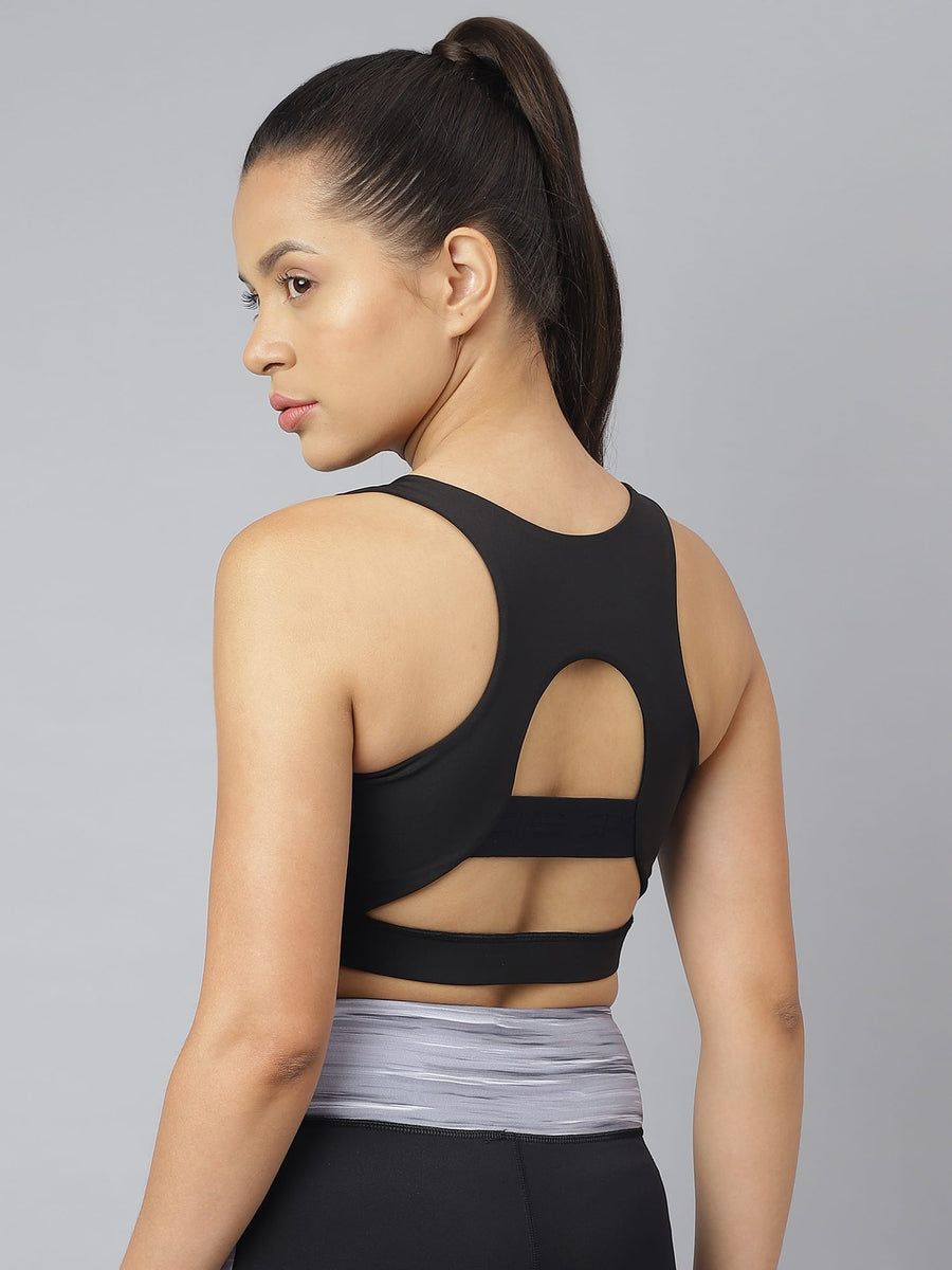 Alcis women's black slim-fit sports training bra with a racerback design and stretch fabric for gym workouts.