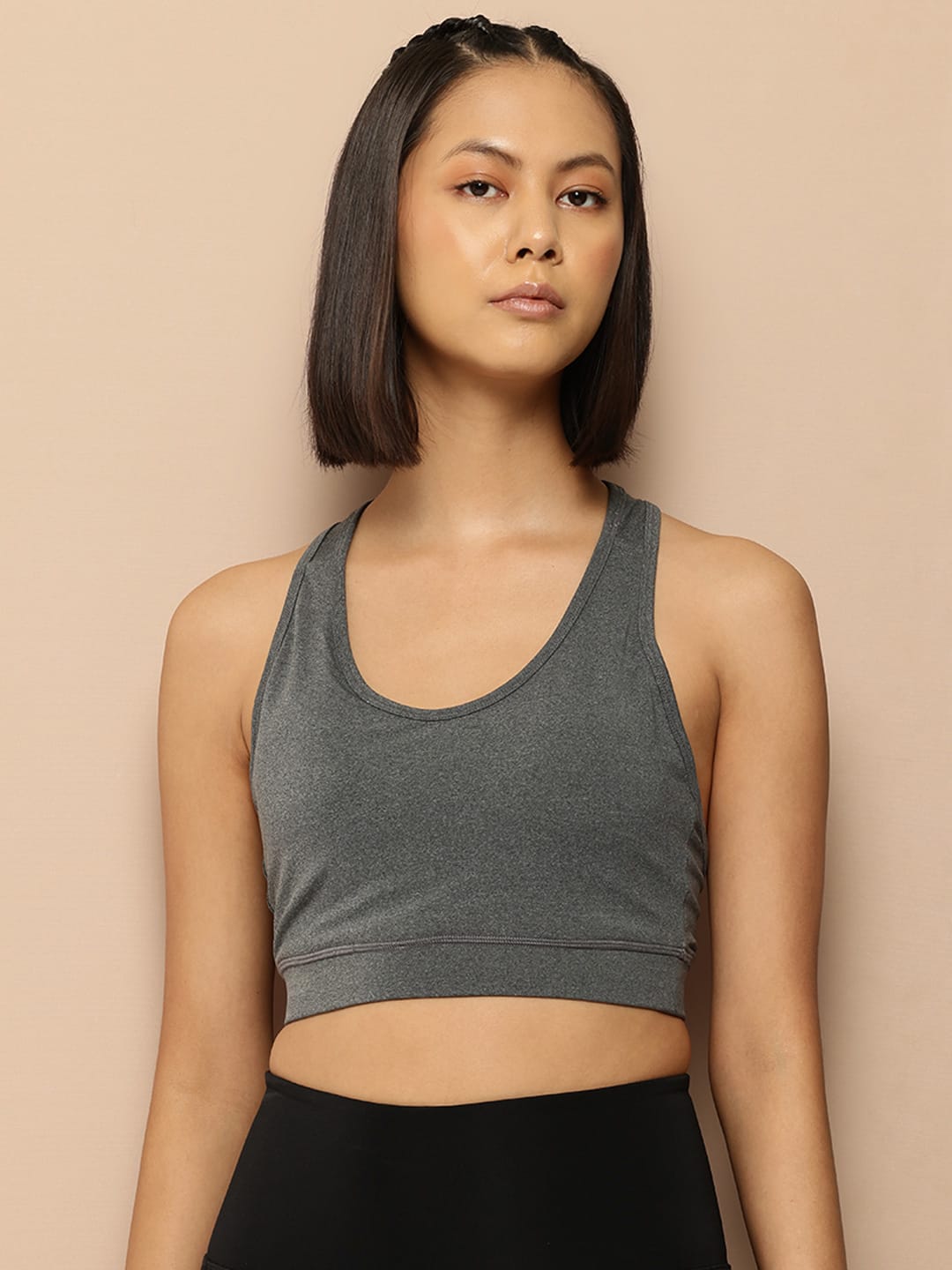 Alcis women grey On The Move sports bra top with slim fit design for workouts and active wear.
