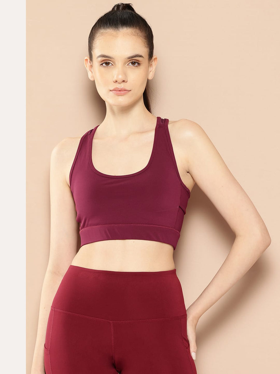Alcis women red solid full coverage sports bra with Drytech+ and Anti-Statix technology for workouts.