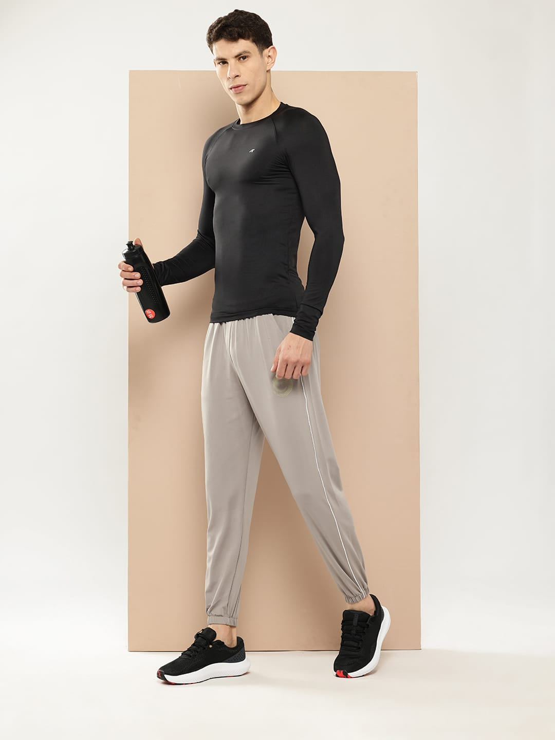 Men's black slim fit athletic compression top with lightweight performance fabric by Alcis.