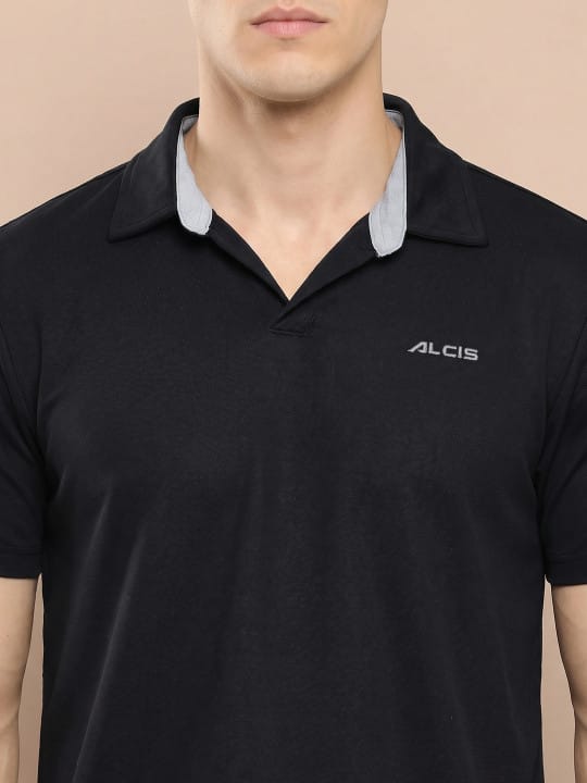 Men's black slim fit sports casual polo by Alcis with lightweight quick-dry fabric for everyday comfort.