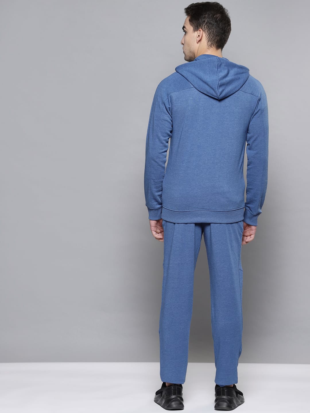 Men's blue tracksuit by Alcis featuring a hooded jacket and comfortable cotton blend track pants.