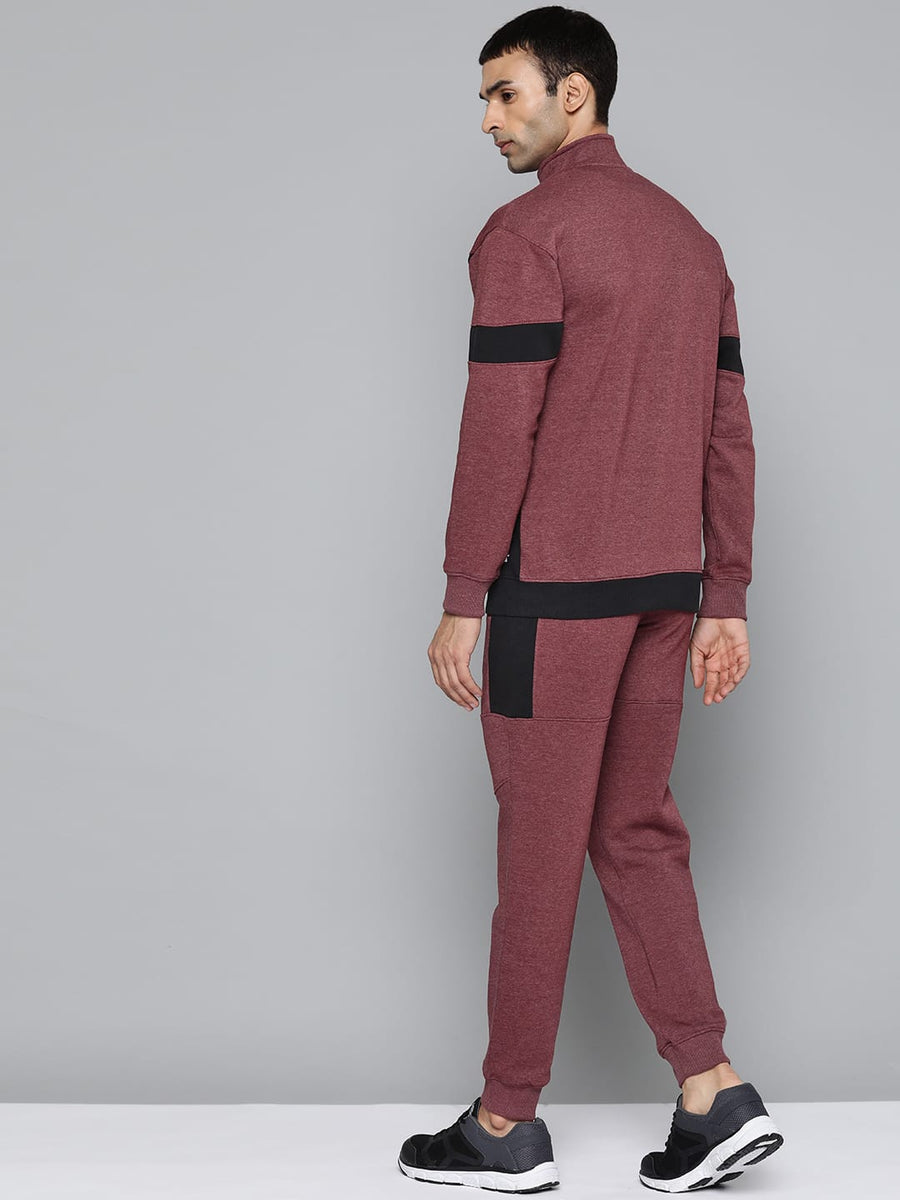 Men's maroon typography tracksuit by Alcis with zip-up jacket and mid-rise track pants.