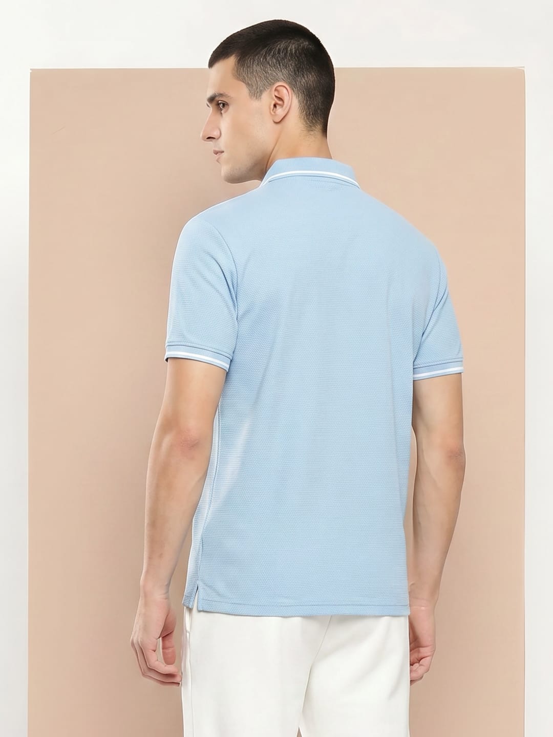 Men's sky blue slim fit polo by Alcis made from lightweight 100% polyester fabric for sports and casual wear.