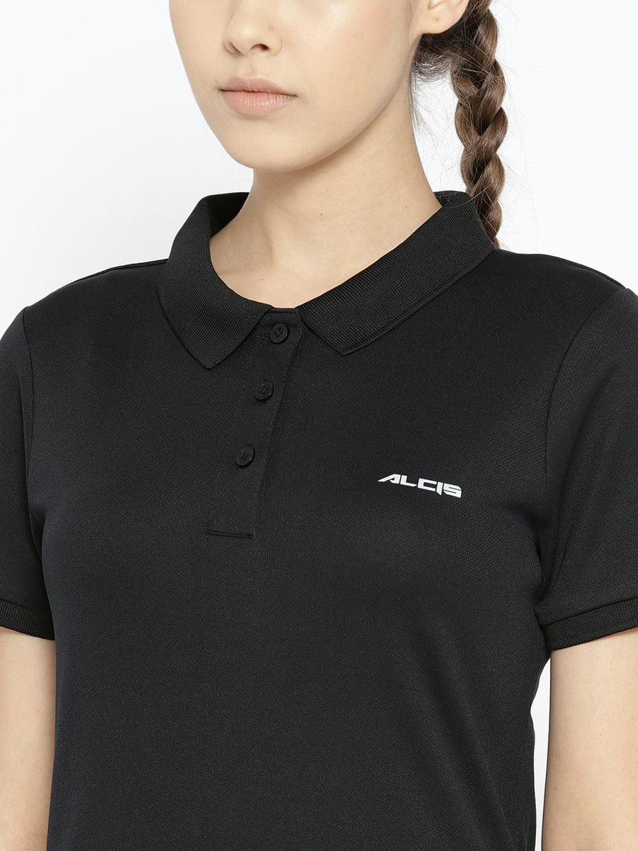 Women's black polo T-shirt by Alcis featuring half sleeves, solid pattern and lightweight sports fabric.