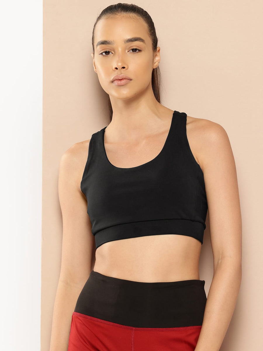 Women's black slim fit sports bra by Alcis featuring Stretch-X fabric and Soft-Touch comfort for training.
