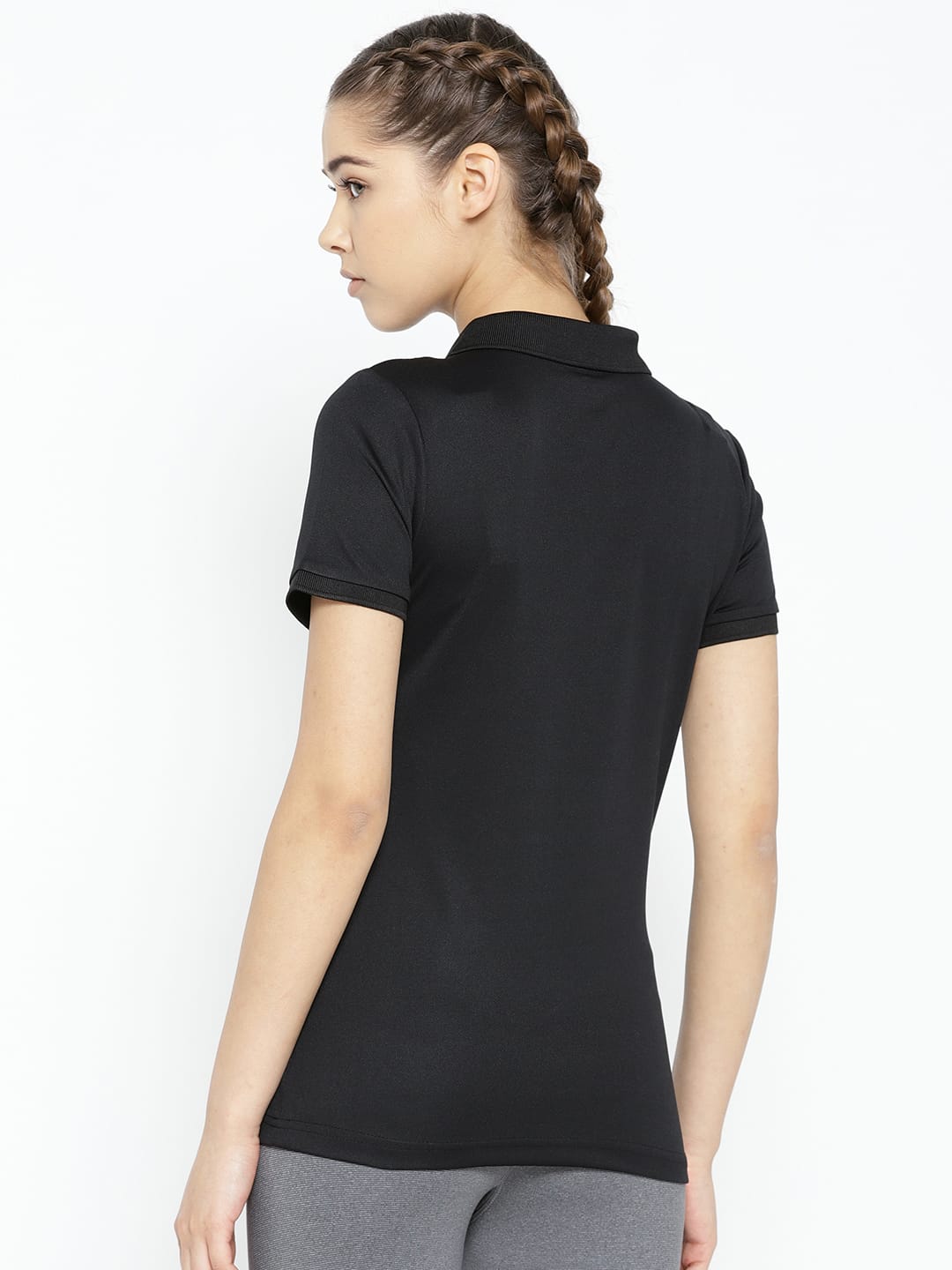 Women's black solid activewear T-shirt with comfortable polyester fabric and stylish polo collar by Alcis.