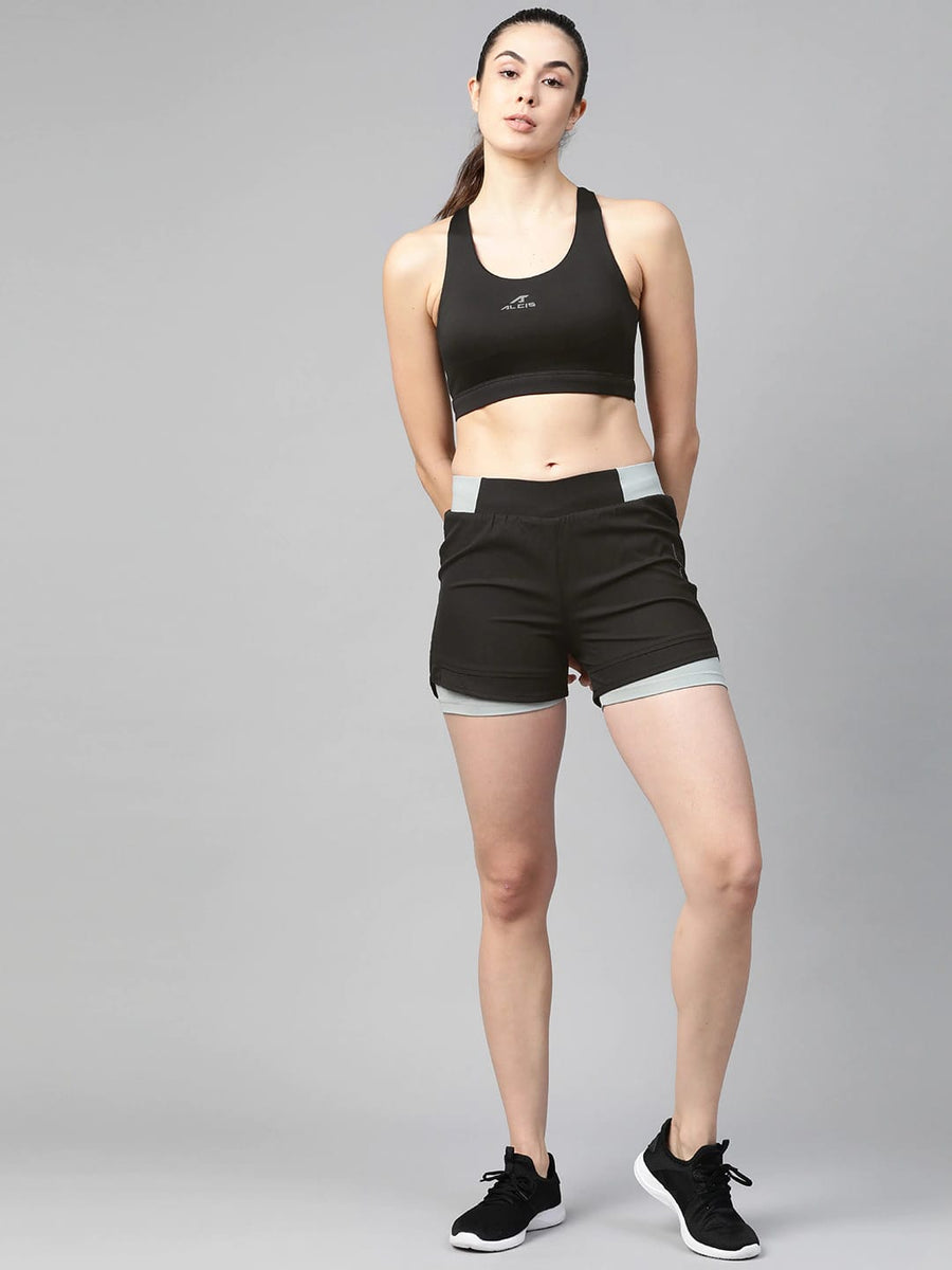 Women's black solid sports bra by Alcis featuring full coverage, round neck and stretch polyester fabric.