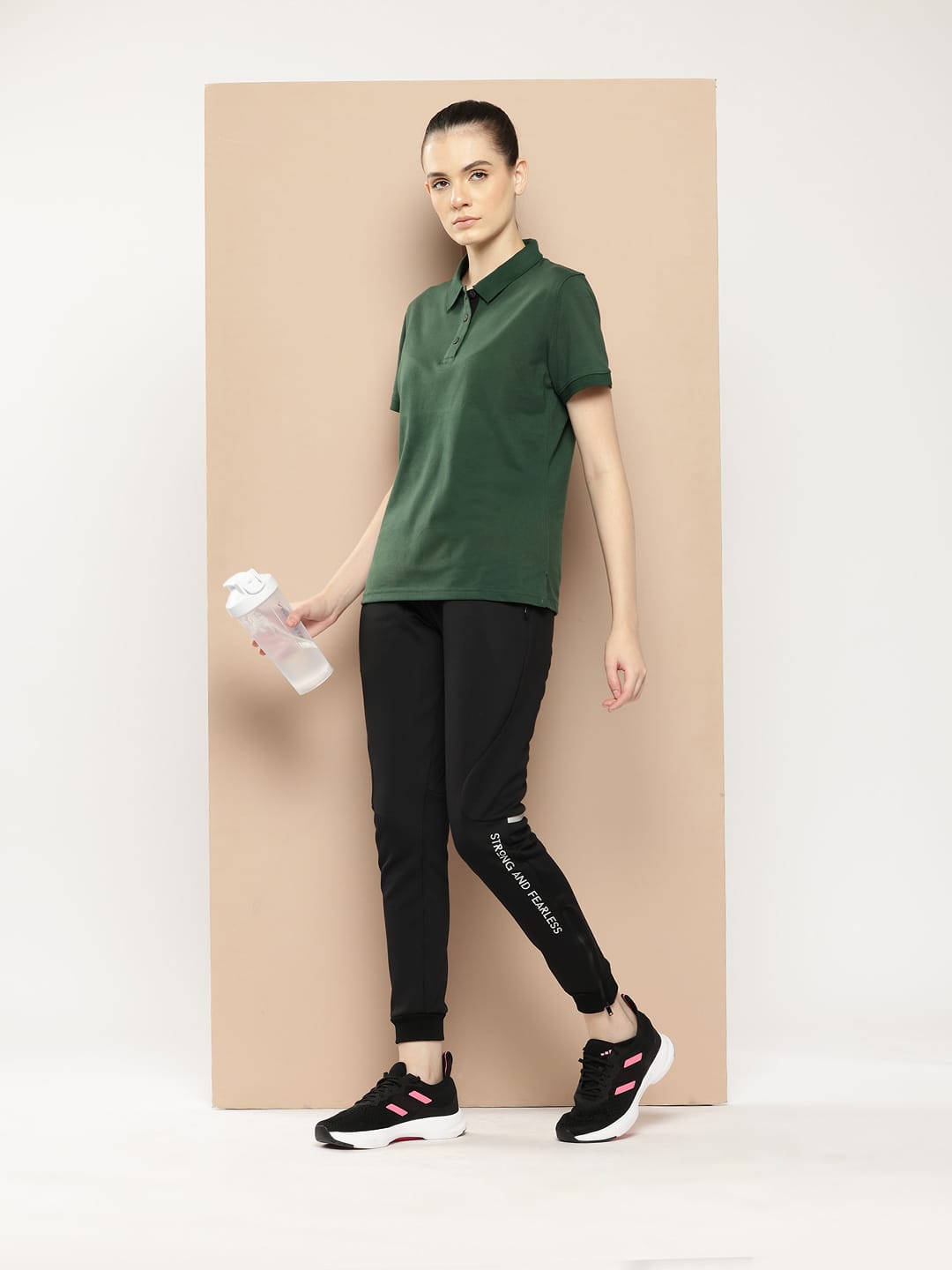 Women's green athleisure polo by Alcis made from breathable cotton poly fabric for active lifestyles.