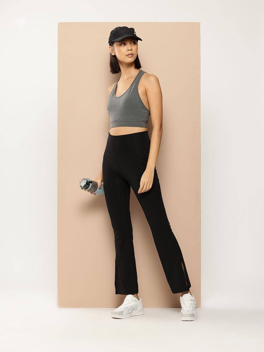 Women's grey sports bra by Alcis made with stretch polyester spandex fabric for gym and fitness training.