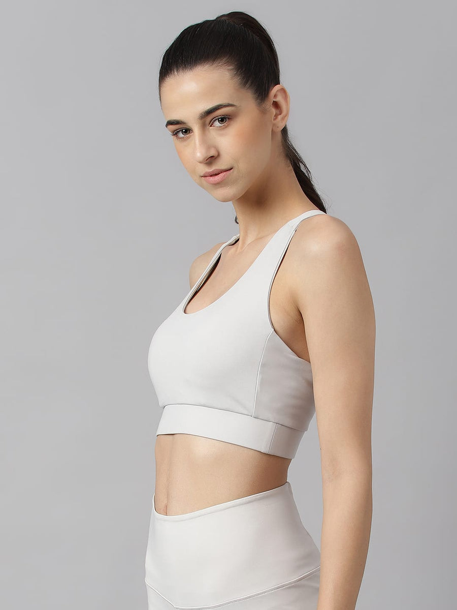 Women's light grey slim fit sports bra by Alcis featuring Stretch-X fabric and Soft Touch comfort technology.