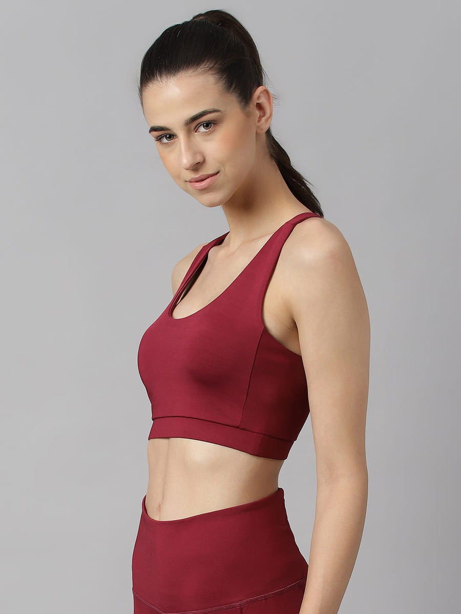 Women's red plum slim fit sports bra by Alcis featuring Stretch-X fabric and Soft-Touch comfort.
