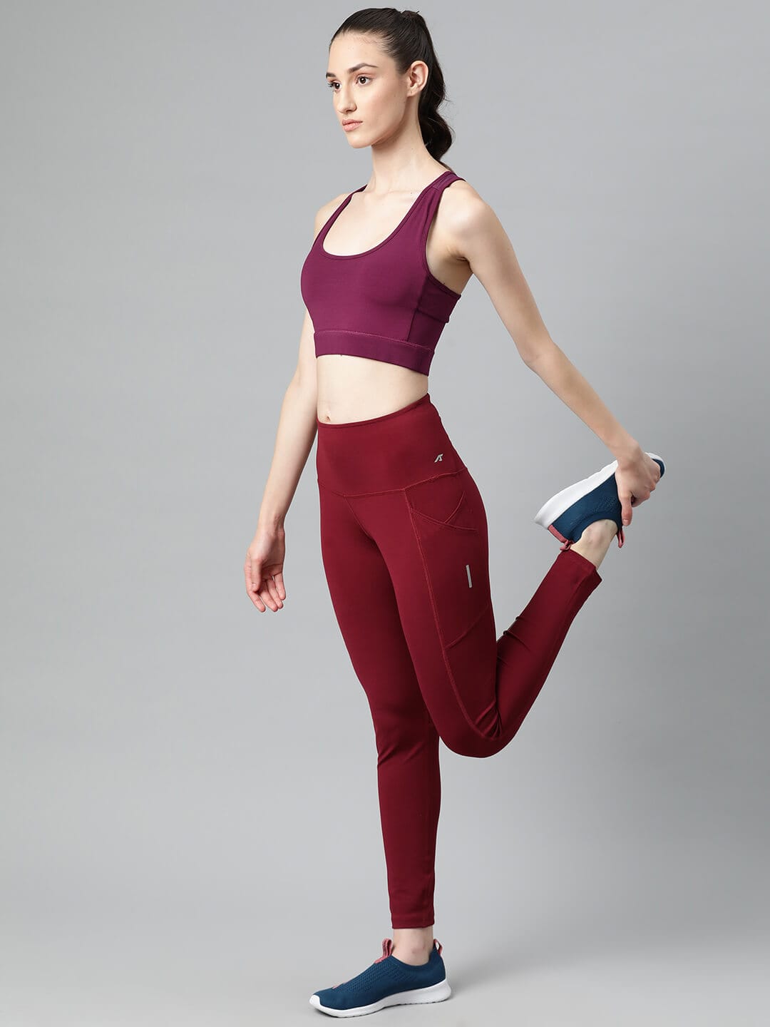 Women's red slim fit training sports bra by Alcis featuring Stretch-X fabric and Soft-Touch comfort.