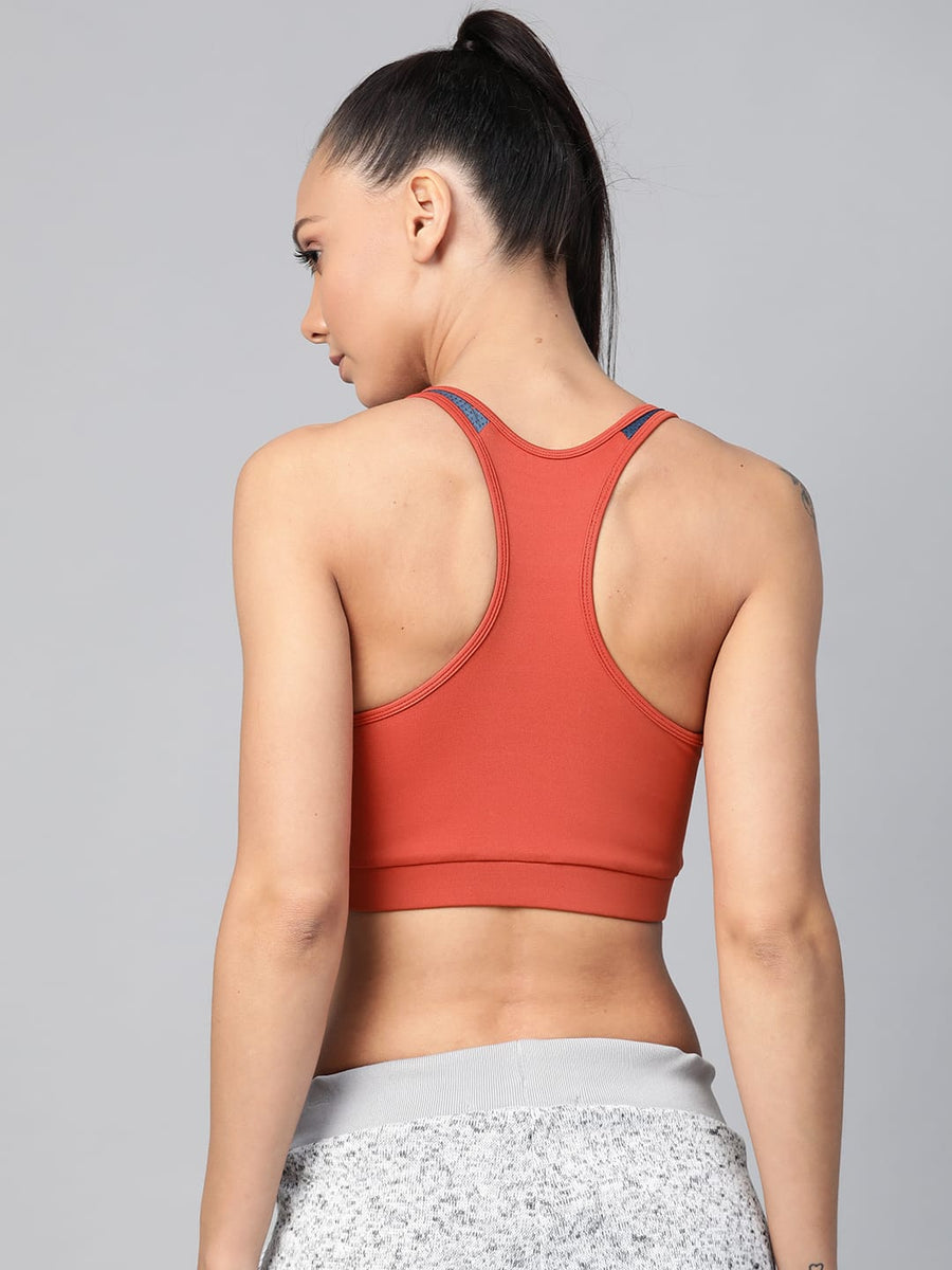 
                    
                      Women's redwood slim fit training bra with non-wired support for gym, yoga and fitness activities by Alcis.
                    
                  