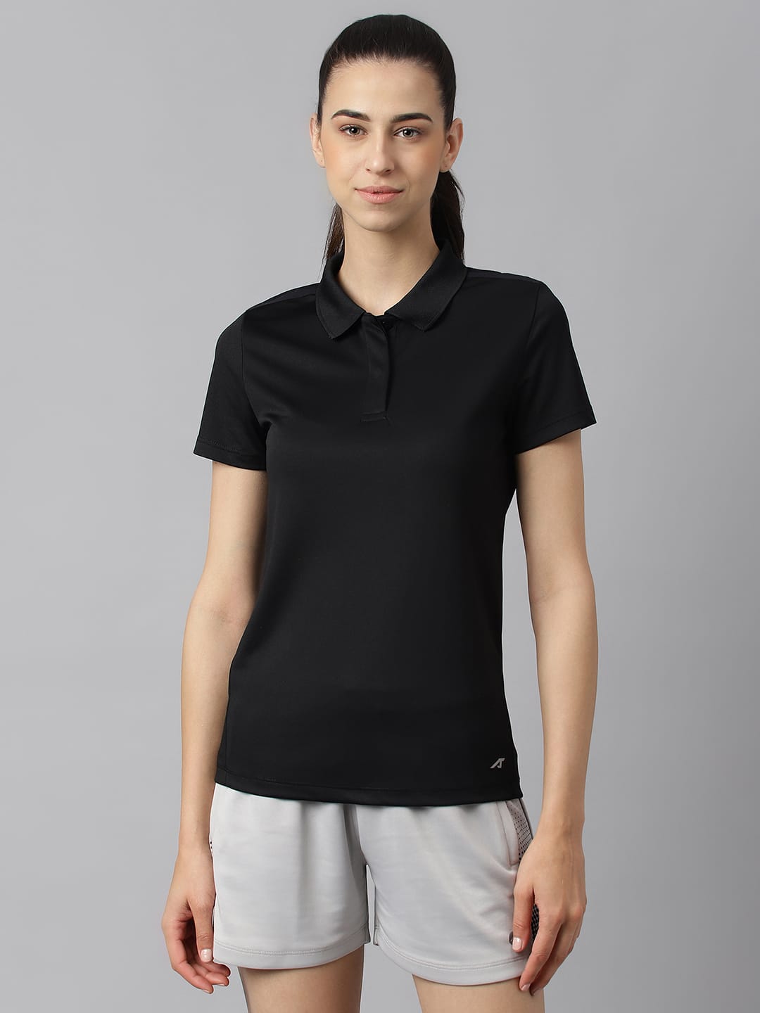 Alcis women black Wonder training polo T-shirt with Anti-Statix, Drytech+ and Soft-Touch technology.