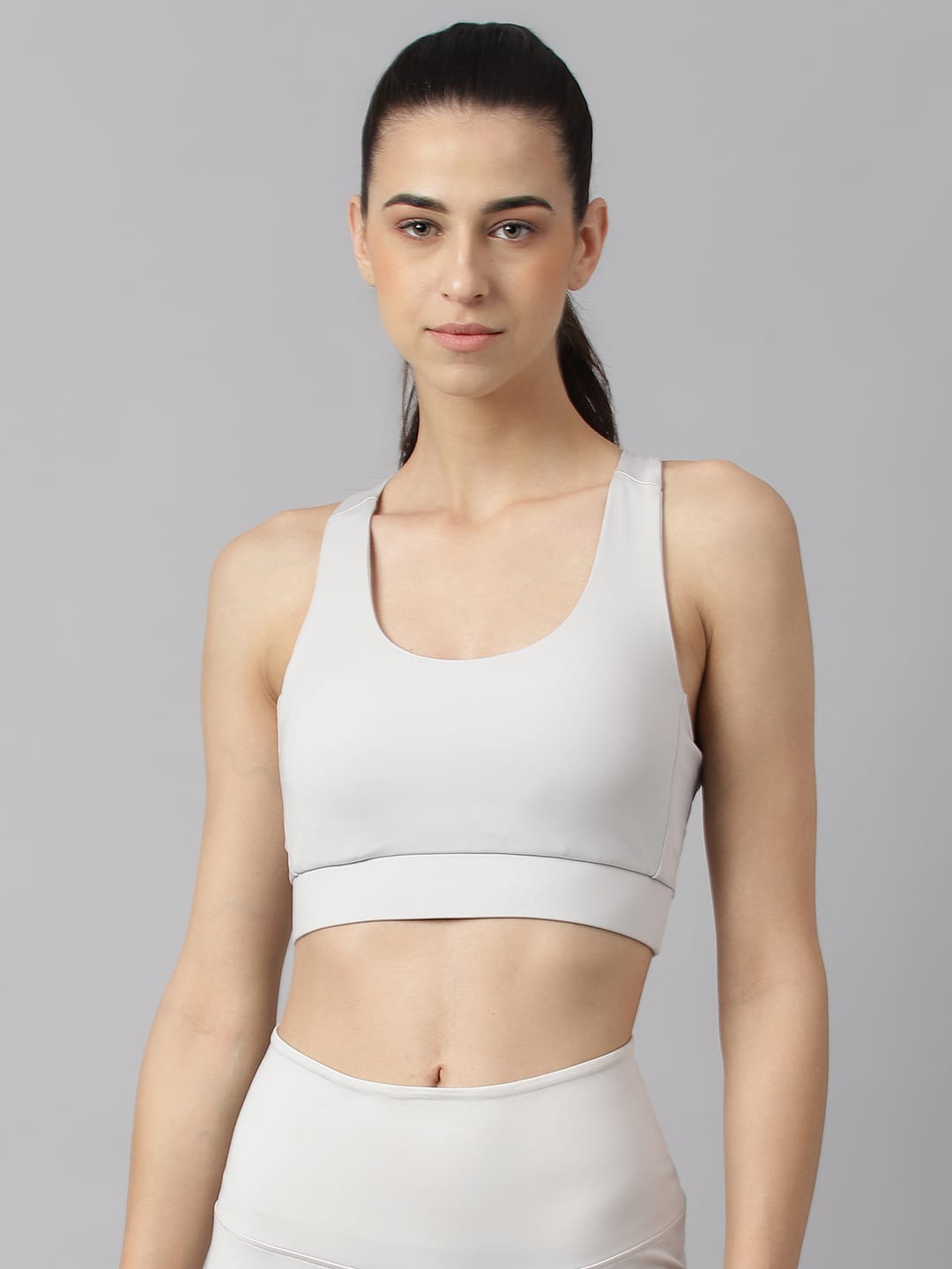 Alcis women light grey low impact sports bra with anti-static and Drytech+ technology for workout training.