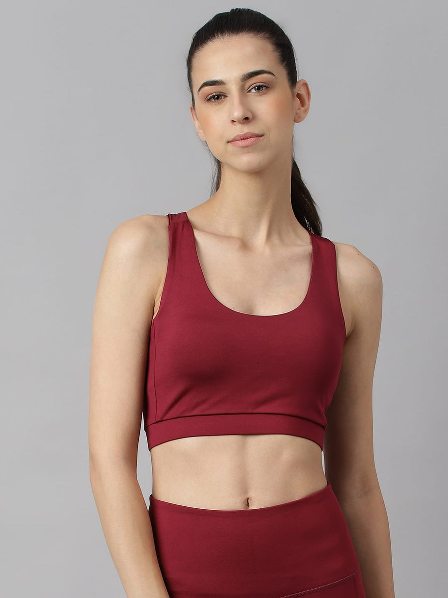 Alcis women red plum low impact sports bra with Anti-Statix and Drytech+ technology for workouts.