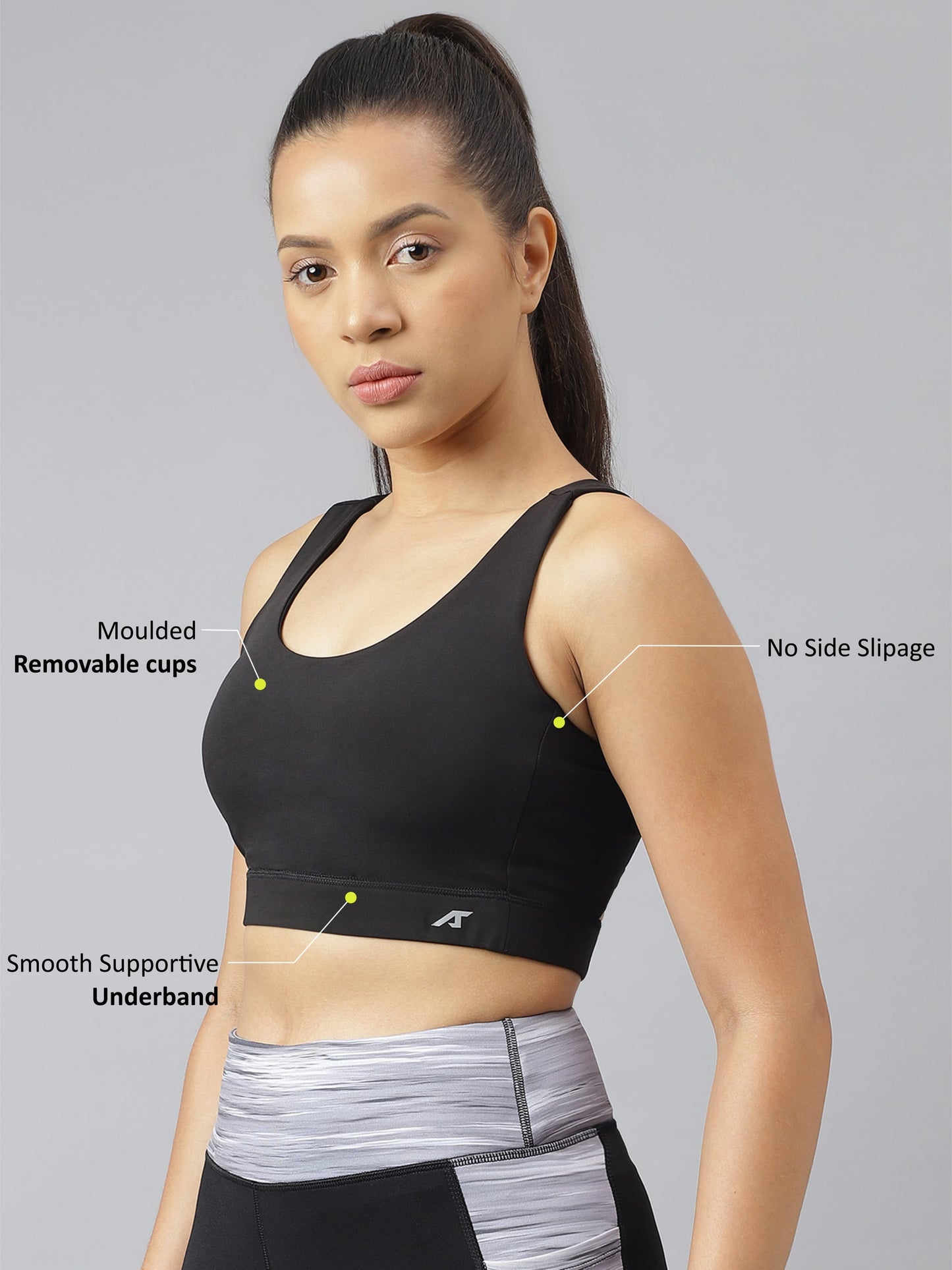 Alcis women's black anti-static slim fit sports training bra with racerback design for gym and fitness workouts.