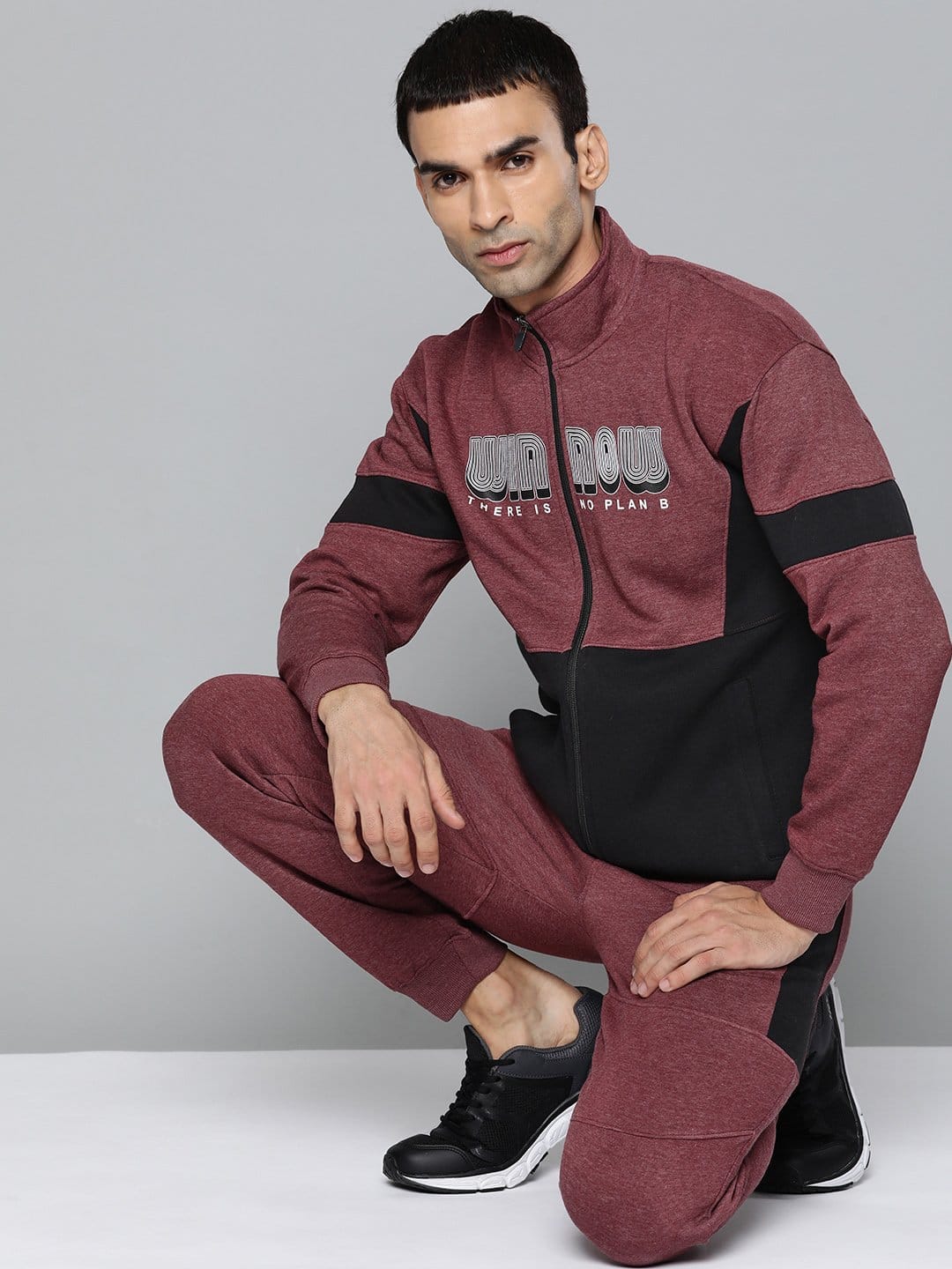 Men's maroon knitted tracksuit with typography design, mock collar and regular fit by Alcis.